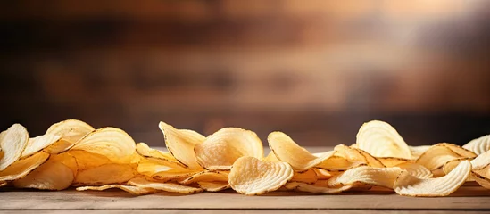 Gordijnen Crunchy Delicious Chips Stack Perfect for Snacking on Rustic Wooden Table © HN Works