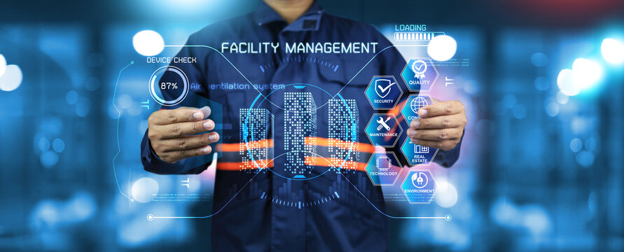 Engineer holding virtual dashboard to monitoring facility management work in real estate maintenance system