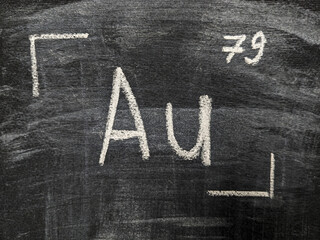 The chemical element is gold with a serial number from the periodic table. Chalk drawing.