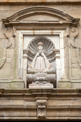 Religious statue on a house in Santiago de Compostela
