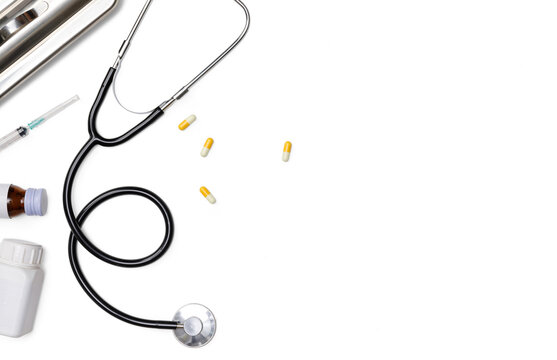 Creative flatlay of doctor medical equipment white table with stethoscope, medical documents, thermometer, syringe and pills, Health care concept, PNG transparency with shadow