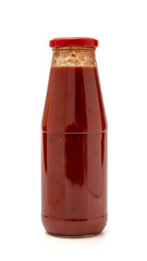 glass bottle with tomato puree. isolated white background
