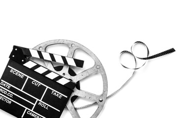 Film reels and clapperboard - cinema and filmmaker concept