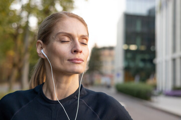 A fitness-conscious female engaged in a jogging session on a city pathway, surrounded by urban architecture and the warm glow of sunset. The scene highlights a lifestyle of health, vitality, and urban