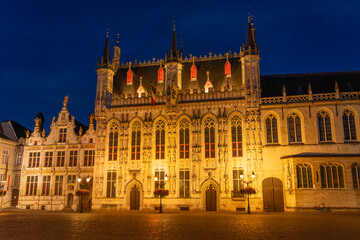Fototapeta na wymiar De Burg square and the city hall of the beautiful city of Bruges in Belgium at night, with its historic facades.