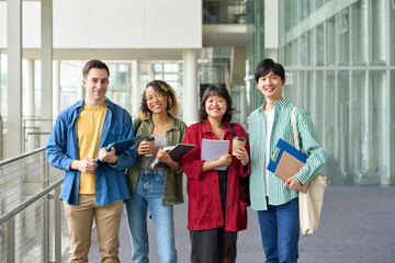 Group of multinational students smiling and lining up at university