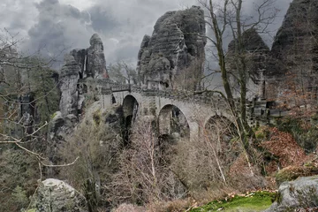 Photo sur Plexiglas Le pont de la Bastei The Bastei Bridge in Saxon Switzerland. jagged rocks, viewing platform to Elbe.