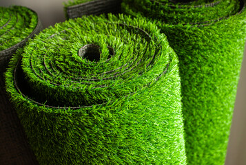 Closed up of synthetic artificial rolled green grass