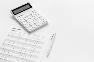 Answer exam sheet form on a table, top view. Education background