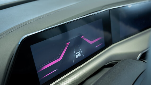 Close-up of an electronic dashboard in a modern car. 