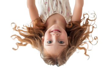 Hanging upside down, a little girl
