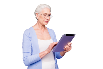 Grey haired old serious business woman wearing glasses, reading browsing using tablet, typing letter. Isolated over violet purple background
