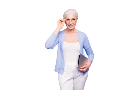 Grey haired old smiling business woman wearing glasses, holding tablet. Isolated over violet purple background