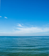 Obraz premium Landscape beautiful summer vertical horizon look view tropical shore open sea beach cloud clean and blue sky background calm nature ocean wave water nobody travel at thailand chonburi sun day time