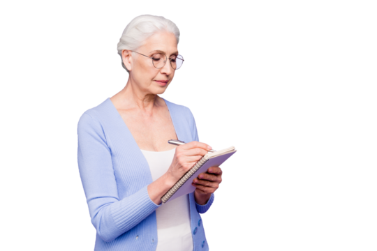 Beautiful nice clever gray-haired old kind lady, nanny, wearing casual and glasses, writing poem in diary. Copy space. Isolated over pastel violet purple background
