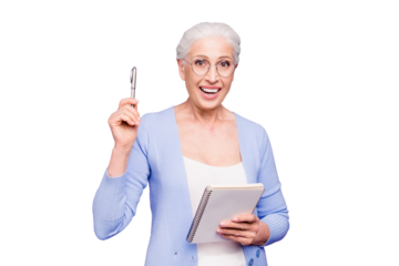 Good idea! Gray haired old cheerful happy smiling business woman wearing glasses, holding paper note book and pen. Isolated over violet purple background