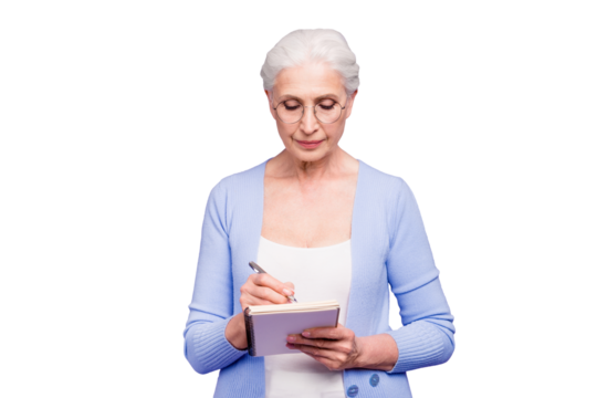 Gray haired old serious business woman wearing glasses, writing plans strategy in paper note book with pen. Isolated over violet purple background - Powered by Adobe