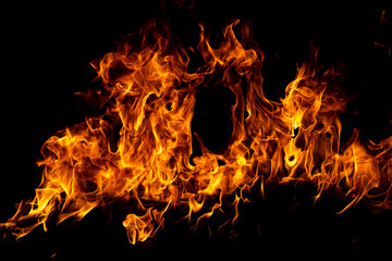 Fire flame. Burn lights on a black background.
