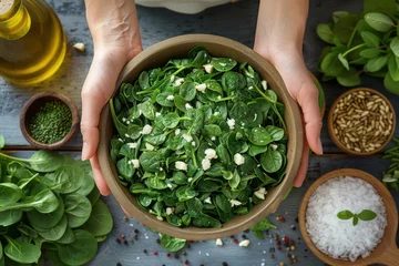 Deurstickers Green spinach salad in large bowl, vegetarian food. Generative AI © masharinkaphotos