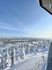 Fototapeta premium Traveller enjoys winter activities in fell. Sunny day on the top of the fell. Finland Lapland is serving its best, near the arctic circle.