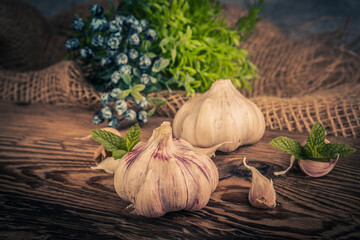 A head of garlic in a rustic arrangement