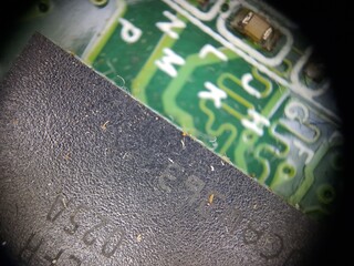 computer PCB board components seen with a macro lens for information content about technology