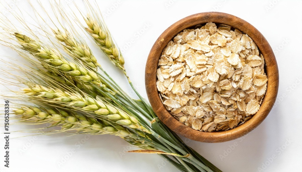 Wall mural oat spike with oat flakes isolated on white background top view