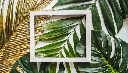 creative nature background gold and green tropical palm leaves minimal summer abstract jungle or forest pattern white paper frame copy space