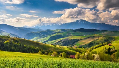 Fototapeta na wymiar panorama of beautiful countryside of romania sunny afternoon wonderful springtime landscape in mountains grassy field and rolling hills rural scenery
