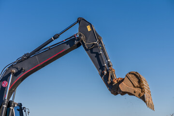 Close up details of industrial excavator working on construction site 5