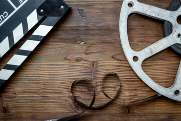 Cinema and filmmaker concept with film reels and clapperboard