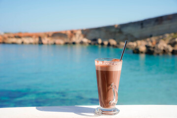 chocolate shake and coffee on the beach. Refreshment in summer vacation