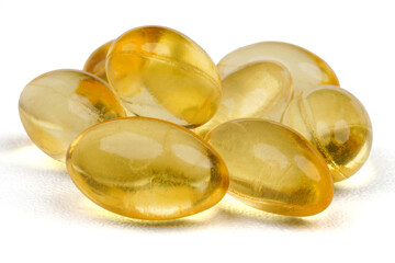Gelatinous capsules filled with cod liver oil and omega 3 concept background