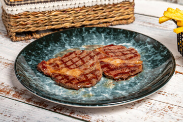 Freshly grilled beef entrecote steak. Delicious ribeye slice cooked on a plate. high quality photo