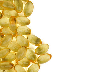 Gelatinous capsules filled with cod liver oil and omega 3 concept background