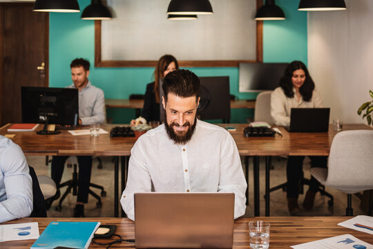 Multiracial people working in coworking creative space - Entrepreneurship and remote work concept