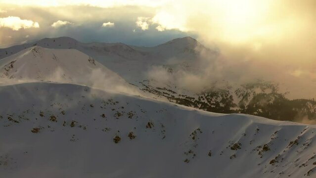 Snowy golden hour sunset sunrise Avalanche terrain Berthoud Pass Winter Park scenic landscape view aerial drone backcountry ski snowboard Berthod Jones Colorado Rocky Mountain peak circle right motion