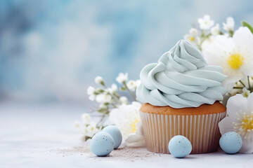 Fototapeta na wymiar Easter cupcakes decorated blossom spring flowers and eggs on pastel blue background. Greeting card. Close up. Easter celebrations. Copy space.