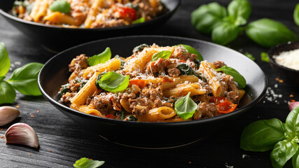 Creamy Tuscan pasta with minced beef, sun dried tomatoes, spinach and parmesan cheese