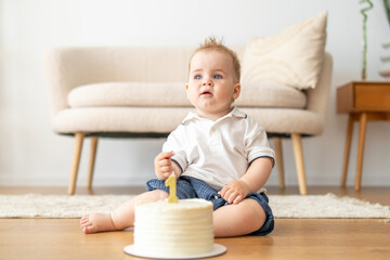 Baby Sitting in Front of Cake