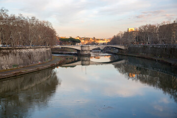 View of the Garibaldi bridge in Rome, Italy. The river connects Trastevere to the historic center of the city by crossing the Tiber river.