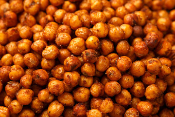 Roasted spicy chickpeas in bowl. Healthy snack.