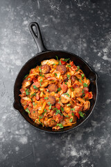 Stew cabbage with a sausage and bacon.
