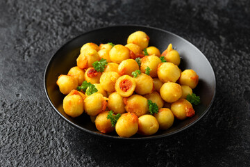 Homemade Italian stuffed gnocchi with tomato sauce