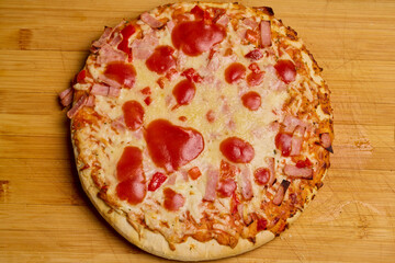 pizza cooked on a wooden board