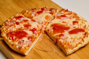 pizza cooked on a wooden board