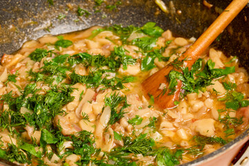 stew mushrooms (Pleurotus) in a pan while they are being cooked.
