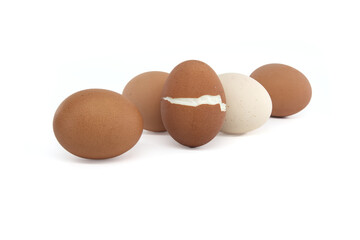 Eggs with varying colors, one egg cracked during boiling