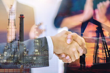 Double exposure of businessman handshake with Crude Oil pump oil rig energy industrial machine for...