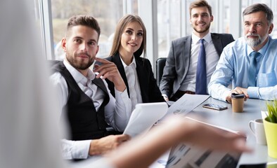 Business People Having Board Meeting In Modern Office